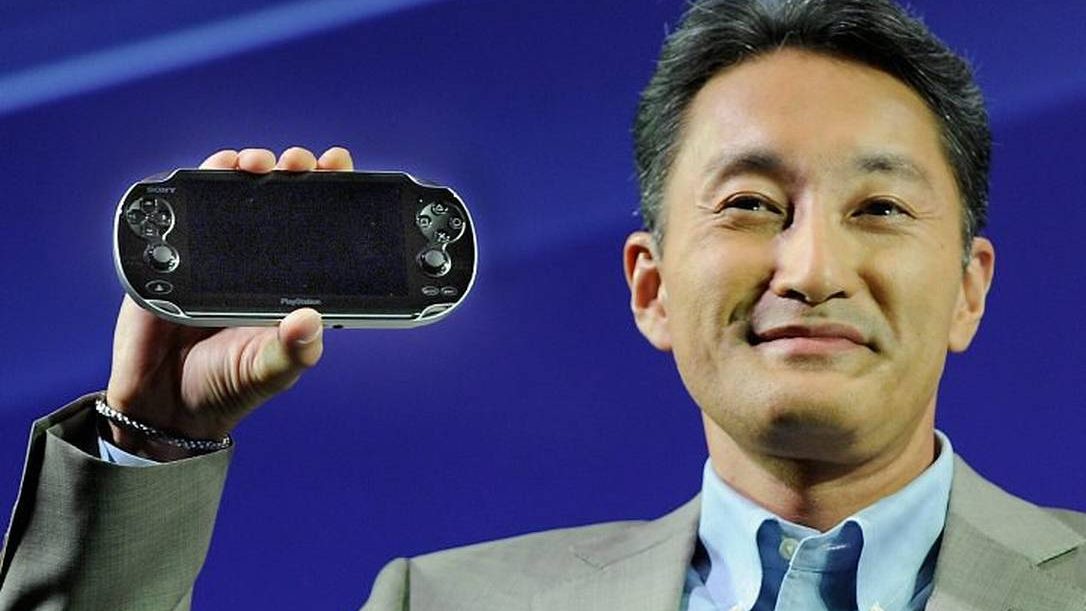 Kaz Hirai holding PlayStation Vita